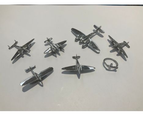 Six miniature handmade aircraft, one as a brooch and a ring