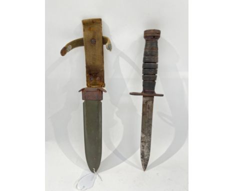 A US Army M3 trench knife housed within a US M8 scabbard by Beckwith Manufacturing Co., worn