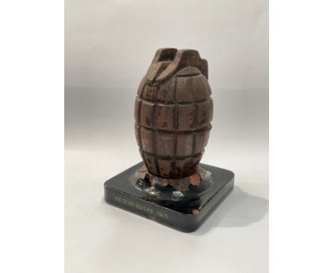 A WWI Mills grenade replica casting converted into a moneybox, mounted onto ceramic base, '1915 Memento of the Great War actu