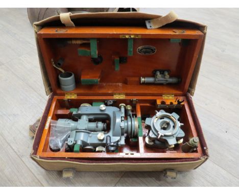 A cased Cooke, Troughton &amp; Simms theodolite with canvas cover