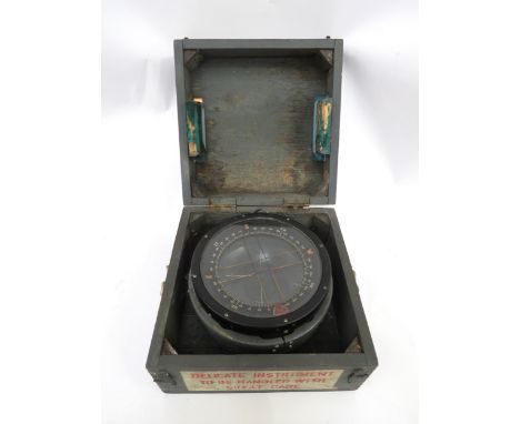 A WWII P10 aircraft compass with original case