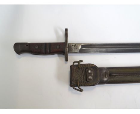 A WWI Remington bayonet dated 1917, with scabbard