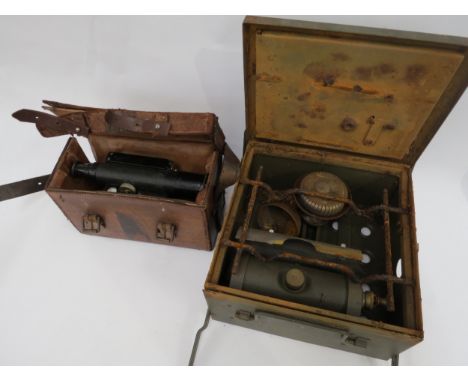 A leather cased theodolite by Watts &amp; Son, together with a cased military stove (2)