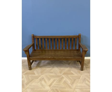 Hardwood garden bench with a slatted seat and back and arm rests, 161 x 63 x 90cms. Estimate £40-60.