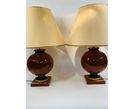 Pair of ceramic table lamps with shades, lamp height 47cms and with shade 77cms. Estimate £30-50.