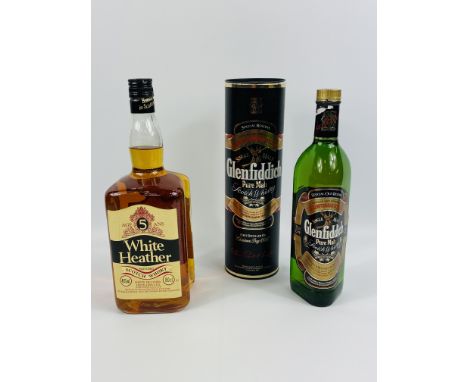 75cl bottle of Glenfiddich pure malt Scotch whisky; 150cl bottle of White Heather Scotch whisky. Estimate £30-50.