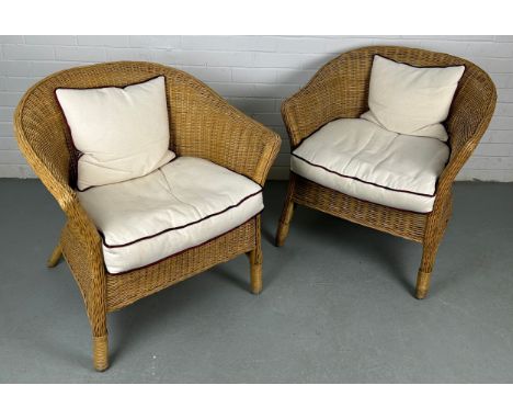 A PAIR OF BAMBOO / CANE ARMCHAIRS (2),Each with white cushion seat. 75cm x 70cm x 65cm each. 