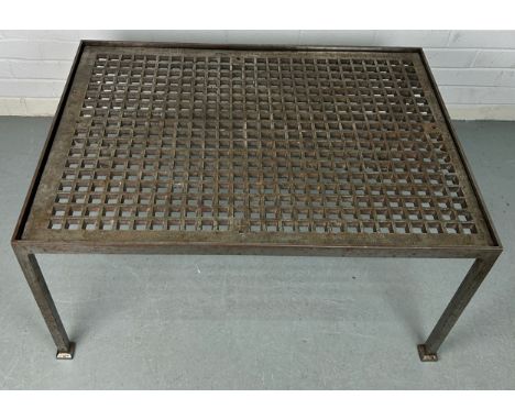 A BRUTALIST DESIGN COFFEE TABLE MADE FROM A SEWER GRATE SET IN A HEAVY METAL FRAME,88cm x 63cm x 45cm 