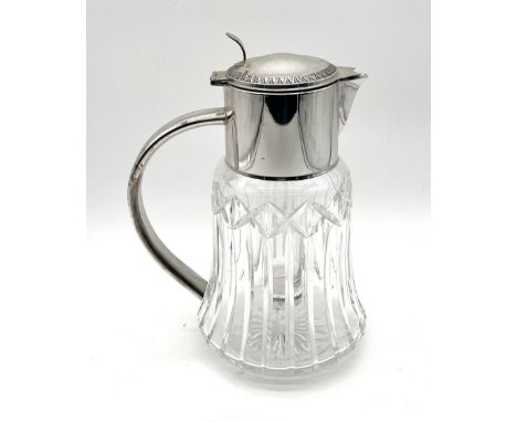 A silver plated cut glass lemonade/water jug with removable cooling cylinder