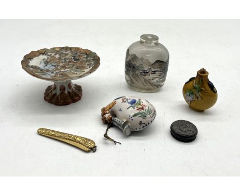 A small collection of Oriental and other items including Chinese snuff bottle with lion decoration, small Japanese footed dis