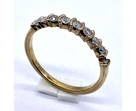 A 10K gold diamond half eternity ring- 1 stone missing, weight 1.7g, size N 1/2