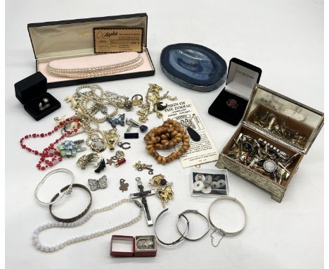 A collection of costume jewellery including a silver hinged bracelet etc.