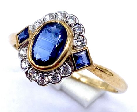 A 9ct gold sapphire and diamond ring with square cut sapphire to the shoulders, Size N1/2, 1.4grams total.