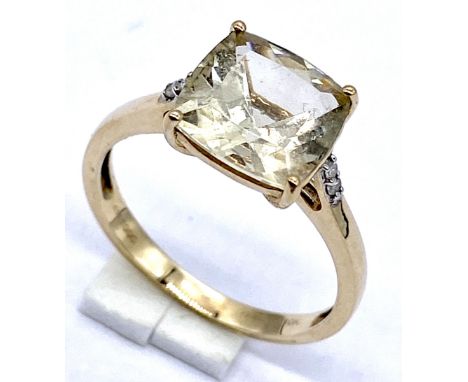 A 10k/375 gold ring with square cut lemon citrine, Size N1/2, 2.3 grams total.