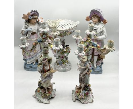 A collection of continental china including a pair of three branch candelabra and raised dish (all with significant repair wo