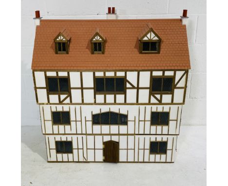 A vintage large Tudor style dolls house with ten internal rooms - overall size height 99cm, width 87cm, depth 50cm
