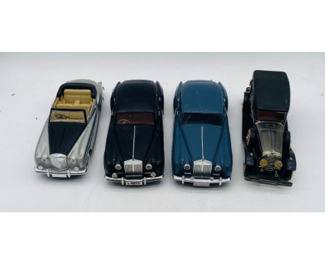 A Solido die-cast Bentley SII 1962 model car, along with three battery operated toy cars 