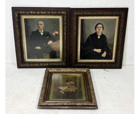 A Victorian oil on board portrait of a lady along with a later portrait of a gentleman in matched framed and coloured photogr