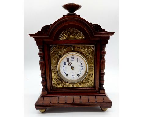 An antique mahogany cased mantle clock with blue and white enamel dial and brass detail to the sides, by J W Benson 25 Old Bo