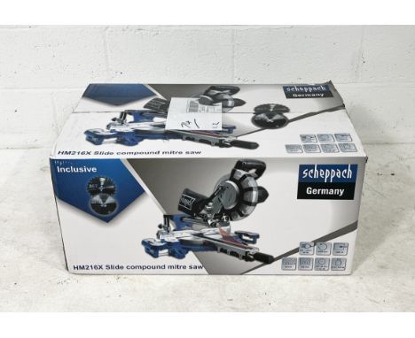 A boxed Scheppach HM216X slide compound mitre saw