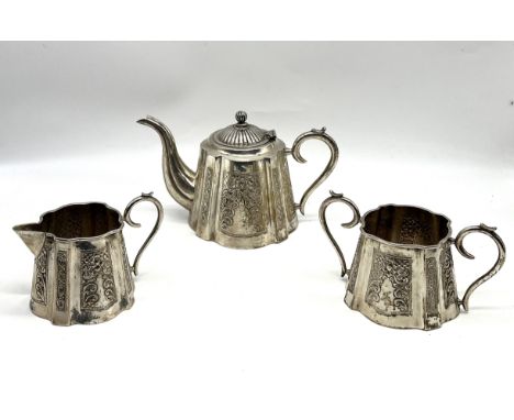 An Eastern silver bachelors tea set comprising of tea pot, cream jug and two handled sugar bowl, total weight 612.6g