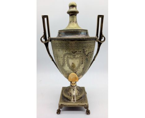 An antique silver-plated trophy shaped samovar on ball and claw feet, 46cm high.