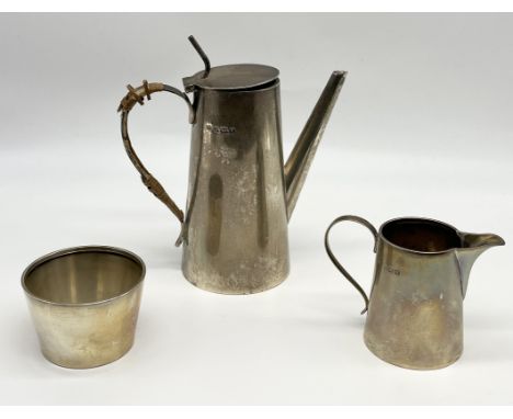 A hallmarked silver three piece coffee set comprising of coffee pot, cream jug and sugar, Birmingham 1915, total weight 359.5