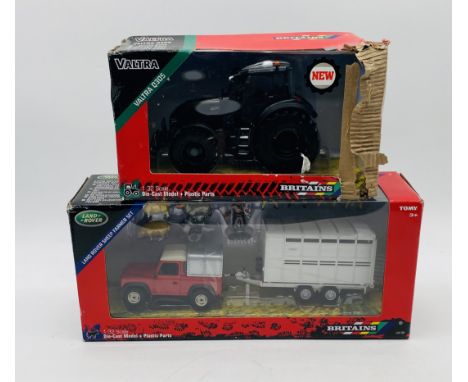 A boxed Britains Tomy die-cast Land Rover Sheep Farmer Set (43138), along with boxed Britains die-cast Valtra Q305 Tractor (4