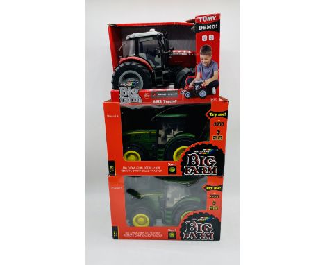 Two boxed Britains Big Farm John Deere 6190R Remote Controlled Tractors, along with a boxed Britains Big Farm Massey Ferguson