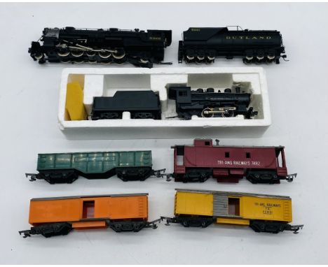 An unboxed Rivarossi OO gauge 2-6-2 "Rutland" steam locomotive (5901) with tender in black livery, along with a Lima Models l