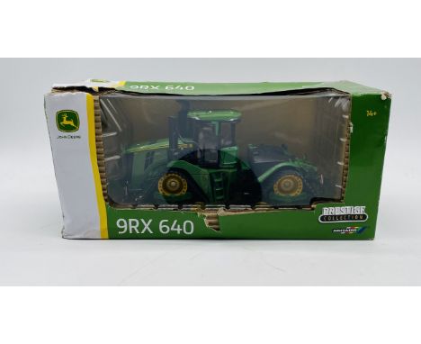 A boxed Britains Prestige Collection John Deere 9RX 640 die-cast tractor - 1:32 scale (box A/F)