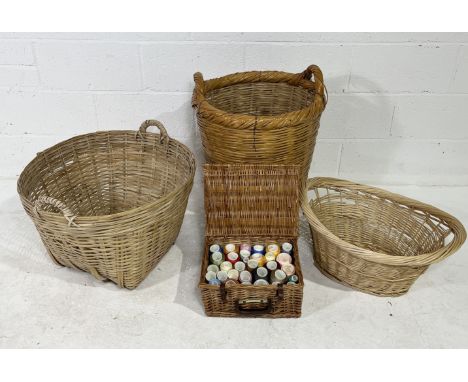 A collection of wicker baskets including hamper full of various threads