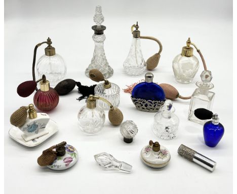 A collection of various scent bottles and atomisers including silver mounted cut glass example