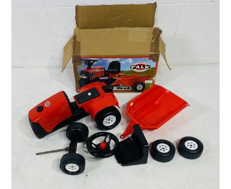 A boxed child's Falk ride on Case tractor with matching trailer