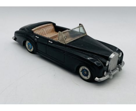A Bandai (Japanese) tinplate early 1960's friction powered Rolls Royce Silver Cloud 4 door open top saloon car in black with 