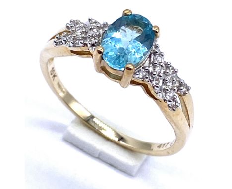 A 10K/375 gold blue and white set quartz ring, Size N, 2.1 grams total.