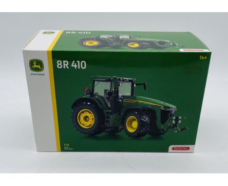 A boxed Wiking John Deere 8R 410 die-cast tractor (1:32 scale)