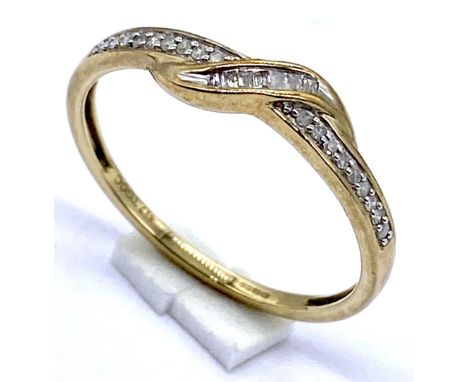 A 10K gold half eternity ring set with diamonds, size R