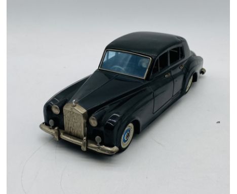 A Bandai (Japanese) tinplate early 1960's friction powered Rolls Royce Silver Cloud 4 door saloon car in black with detailed 