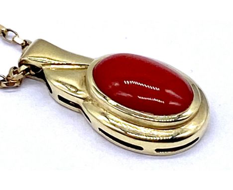 A 9ct gold chain and pendant set with coral, total weight 4.6g