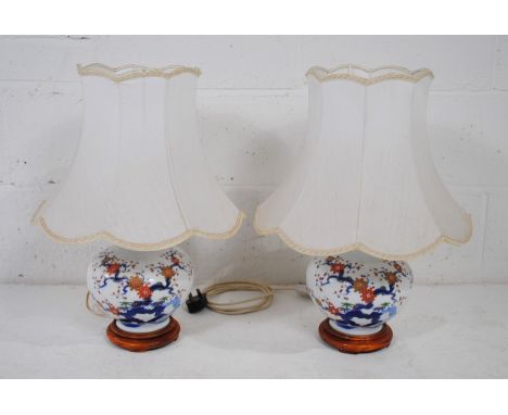 A pair of Japanese Imari pattern ceramic table lamps, with shades