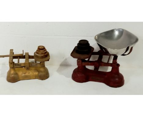 A vintage cast iron set of scales and weights, and another set minus pan.