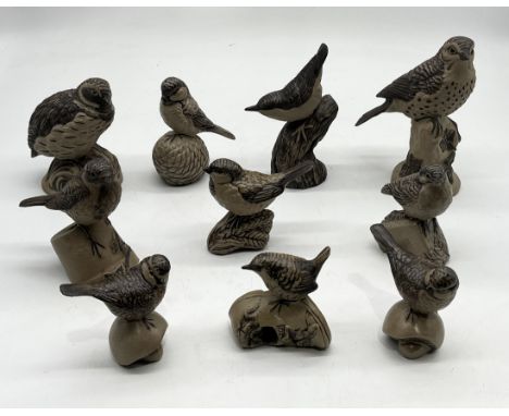 A collection of Poole Pottey stoneware birds including thrush, nuthatch, quail, wren etc.