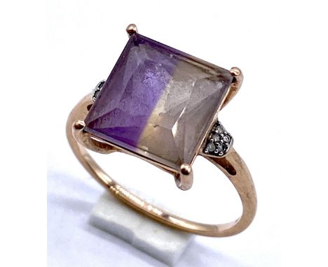 A 9ct gold Princess cut amethyst ring with diamond highlights to shoulder- size K, band slightly squashed