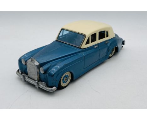 A Bandai (Japanese) tinplate early 1960's friction powered Rolls Royce Silver Cloud 4 door saloon car in blue with detailed p