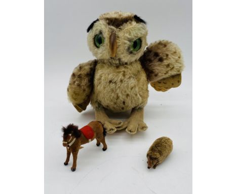 A vintage unboxed Steiff owl (height 24cm), along with two small toy animals in the form of a horse (A/F) and hedgehog, possi