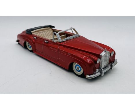 A Bandai (Japanese) tinplate early 1960's friction powered Rolls Royce Silver Cloud 4 door open top saloon car in red with de