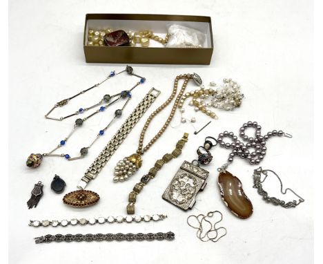 A small collection of costume jewellery including silver fob, silver and amethyst bracelet etc.
