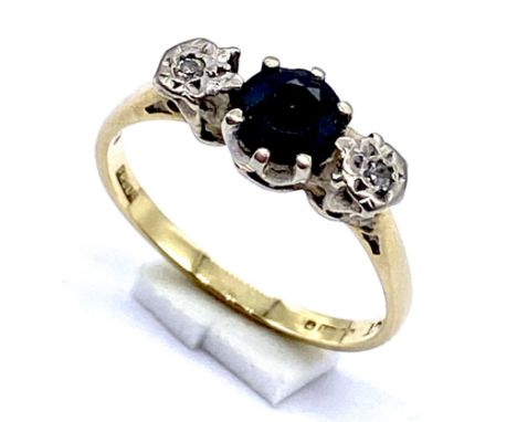 An 18ct gold diamond and sapphire three stone ring, size M, weight 2.6g