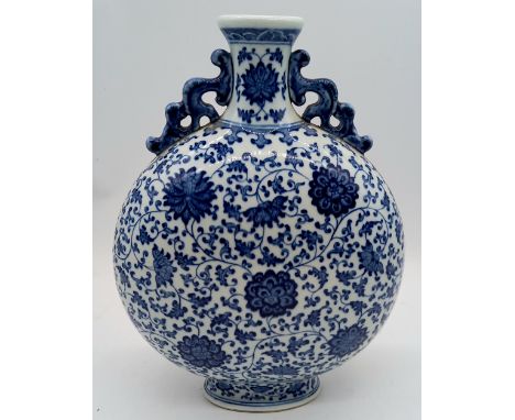 An oriental blue and white moon flask, slight damage to rim